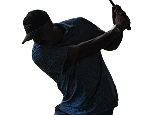 Golfer mid-swing inside the trailer
