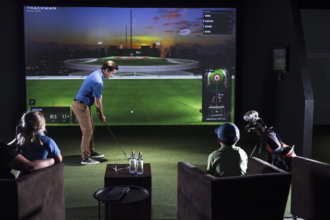 A group enjoying a casual TrackMan simulator game together